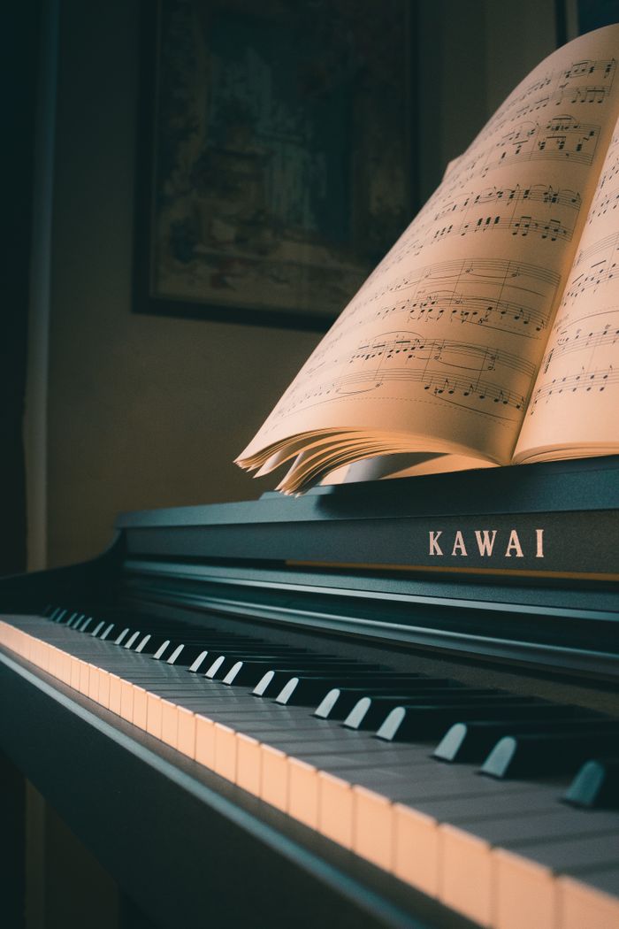 A Kawai piano with an open music sheet, perfect for music enthusiasts and pianists.